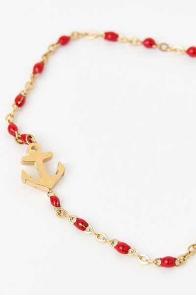 Batela Pulsera o brazalete color dorado con ancla piedra roja. - Batela