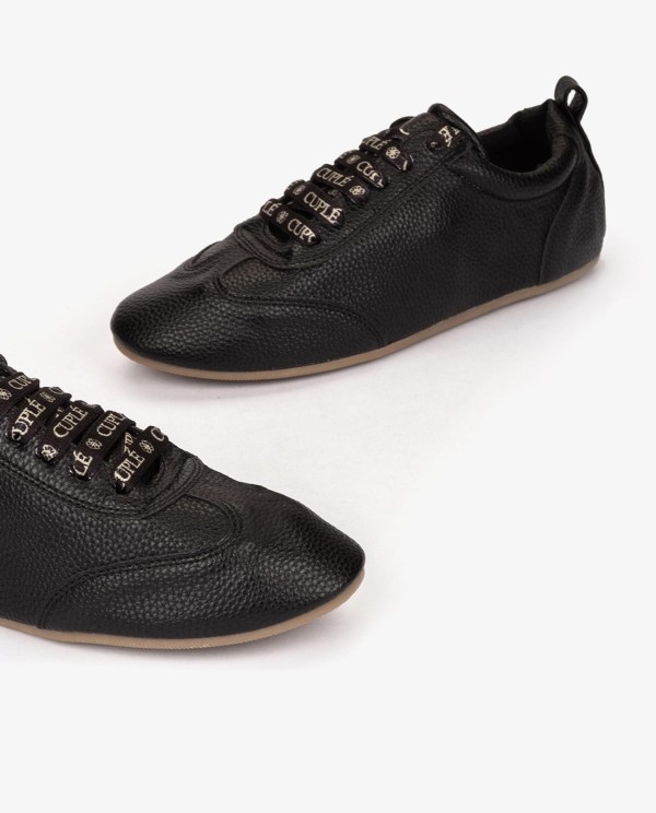 Cuplé ZAPATILLA NEGRA DE TECNOPIEL ESTILO GOLF