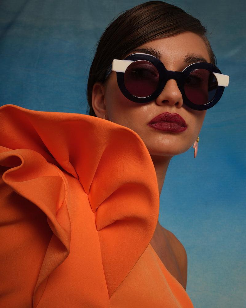 Dolores Promesas Gafa Con Corte Redondo Azul Semitransparente Y Beige