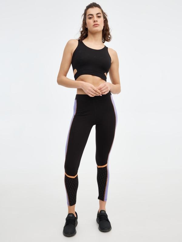 In side Leggings negros con contrastes