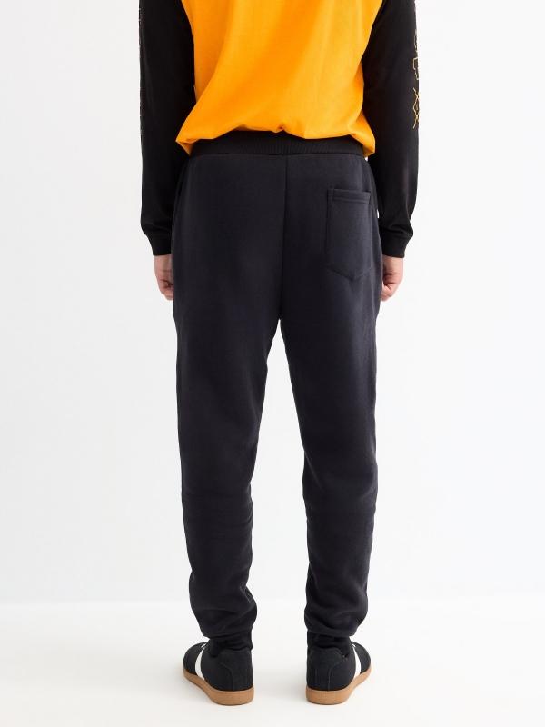 In Side Pantalón Jogger Negro Bolsillos