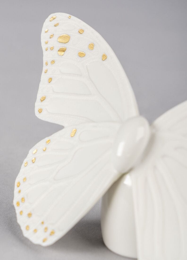lladro Figura Mariposa. Lustre oro y blanco