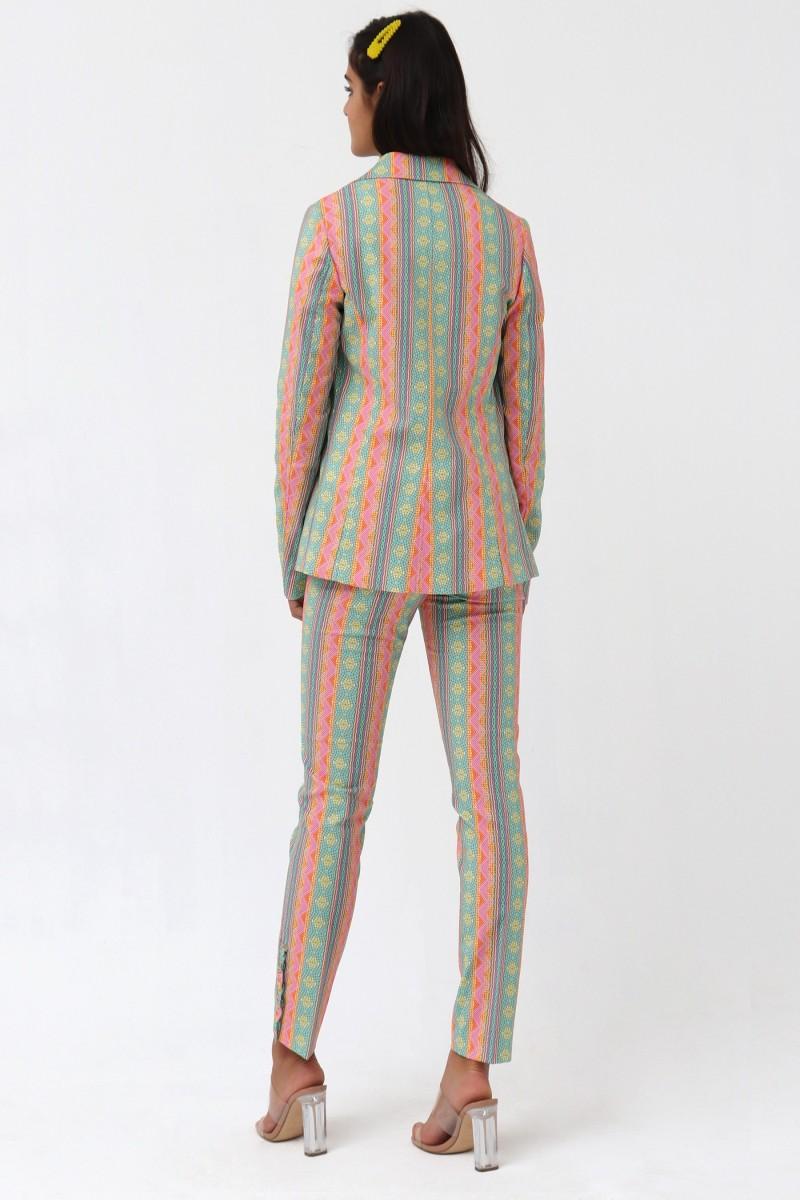 Oky Coky PANTALÓN AJUSTADO VOLANTE BAJO PIQUÉ ESTAMPADO