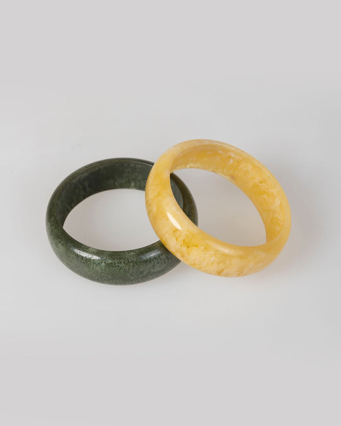 system action Brazaletes rígidos color verde y amarillo