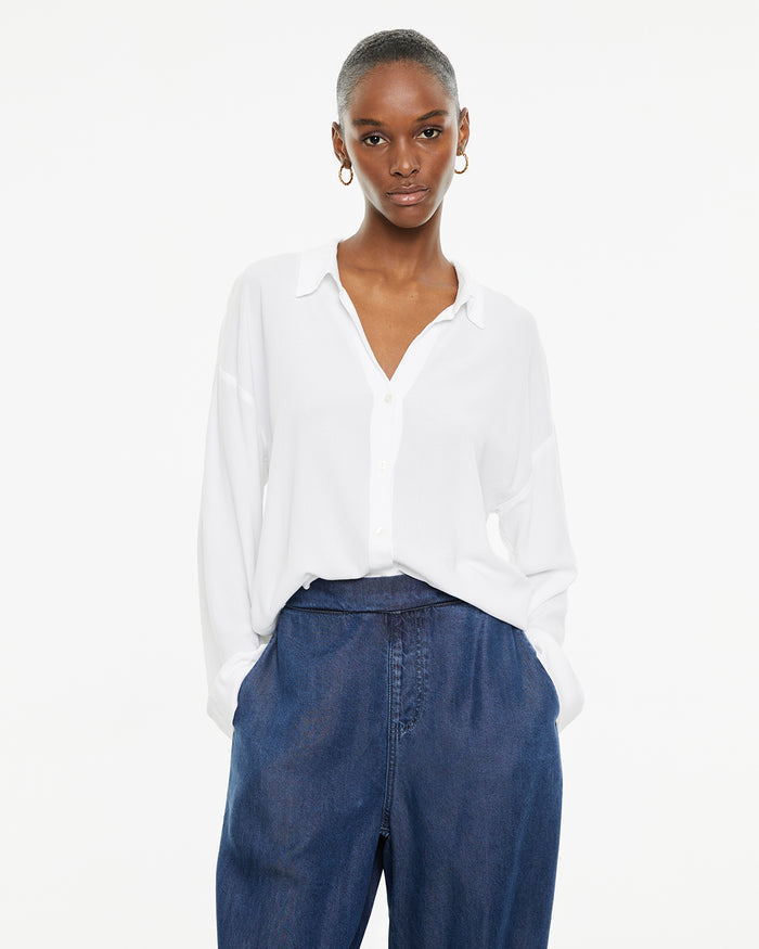 system action Camisa blanca fluida manga larga cierre botones