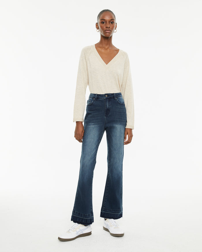 system action Jeans acampanados de tiro medio con bolsillos delanteros