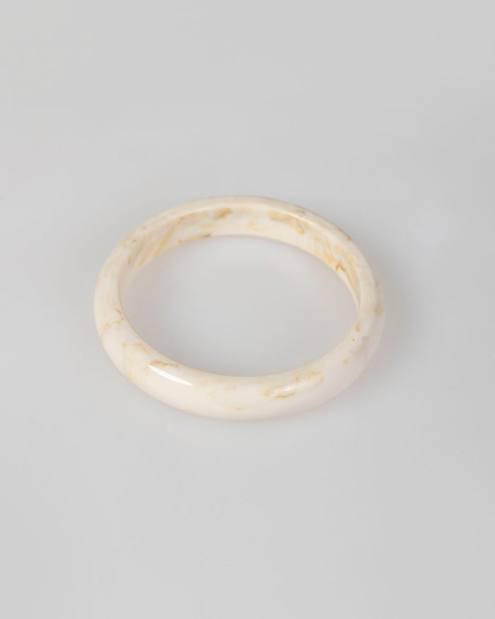 system action Brazalete beige rígido