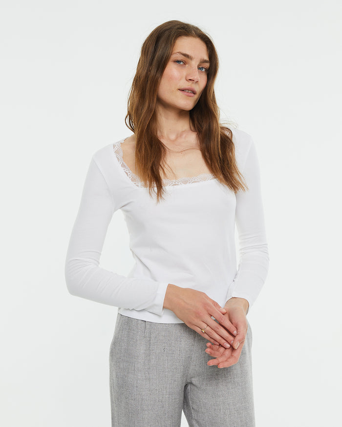 system action Camiseta crop ajustada manga larga