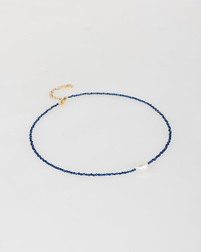 System Action Collar Azul Con Perla Blanca