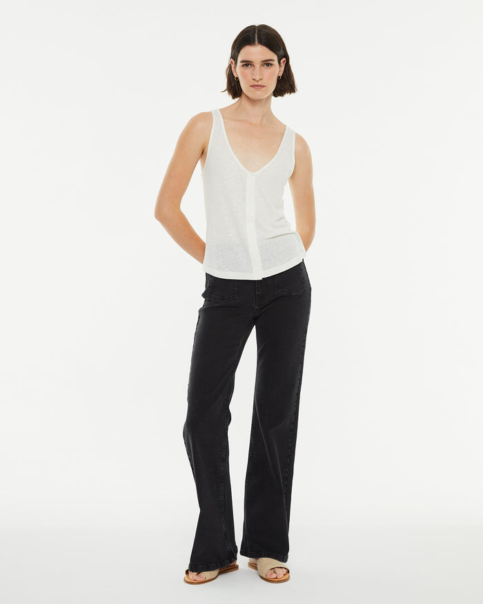 system action Pantalón denim flare tiro medio