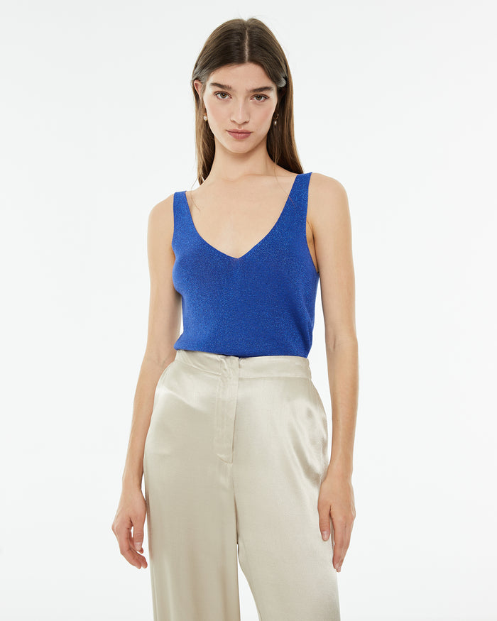 system action Top ajustado de punto con lúrex y brillo