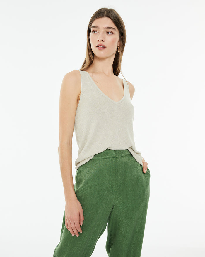 system action Top ajustado de punto con lúrex y brillo