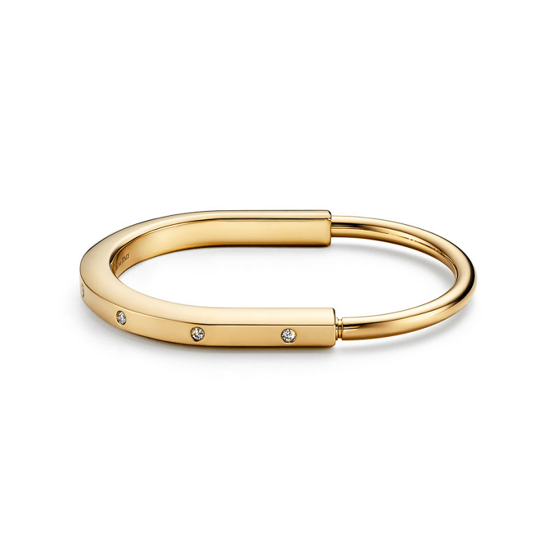 Tiffany & Co. Tiffany Lock Brazalete en oro amarillo con detalles de diamantes