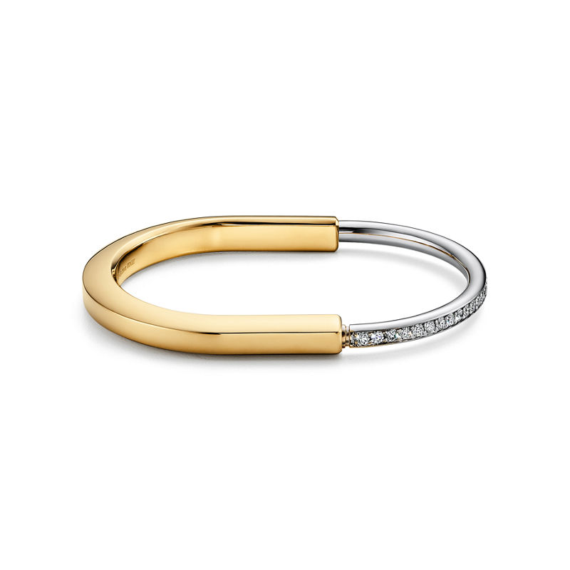 Tiffany & Co. Tiffany Lock Brazalete en oro amarillo y blanco con medio pavé de diamantes