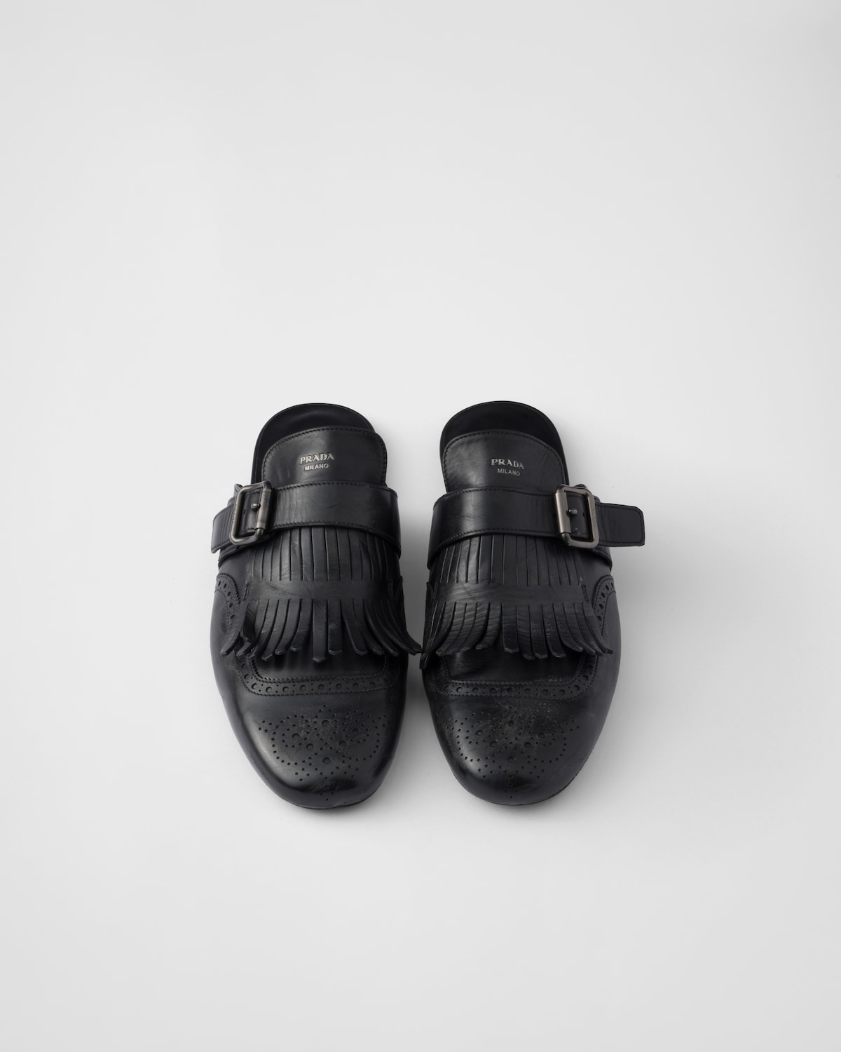 Prada Mules Shuffle De Piel Con Flecos Y Correa De Hebilla