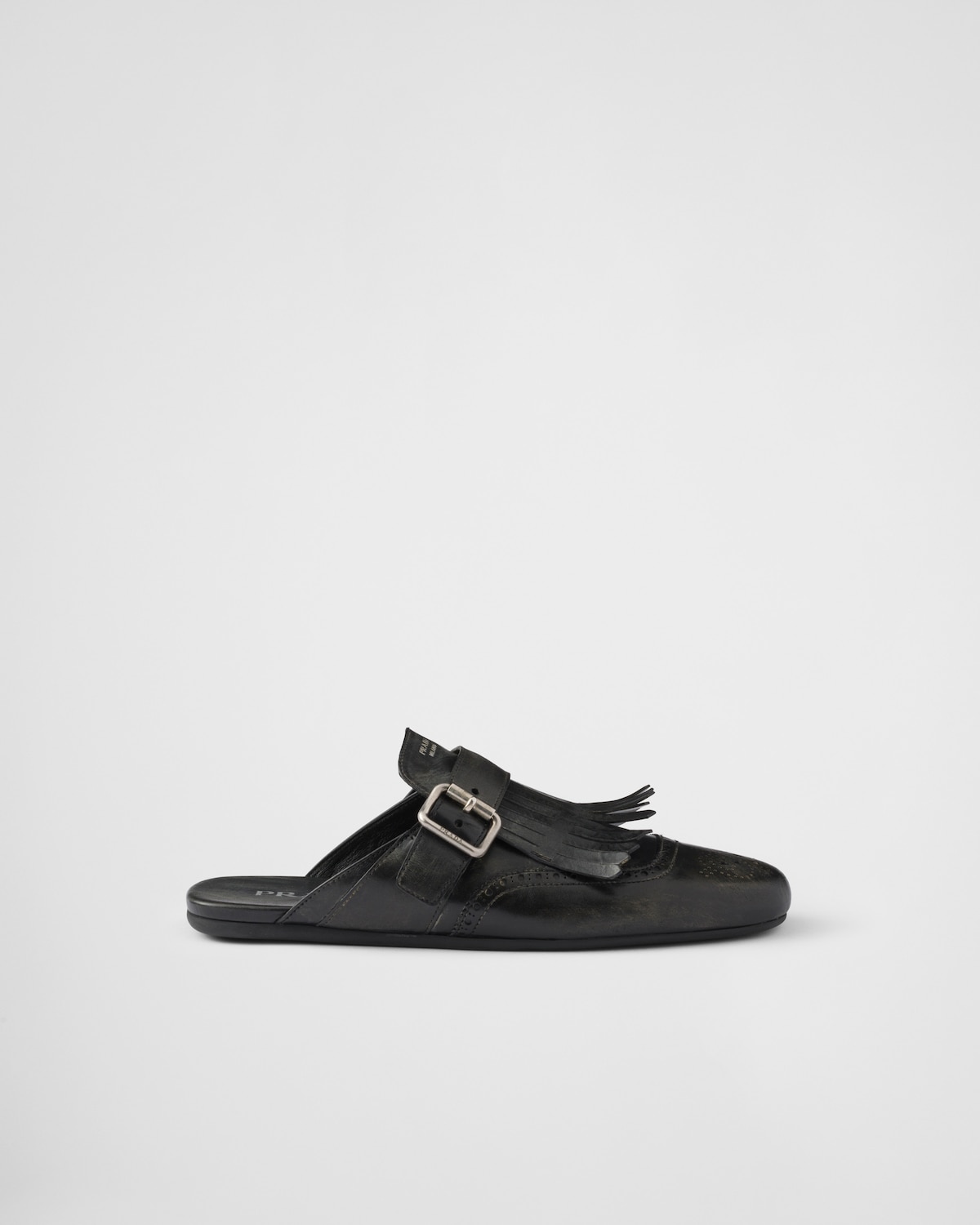 Prada Mules Shuffle de piel con flecos