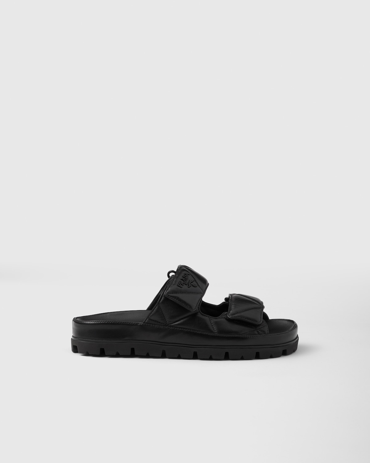 Prada Sandalias planas de napa acolchada