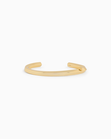 Armani Pulsera tipo brazalete de latón en tono dorado