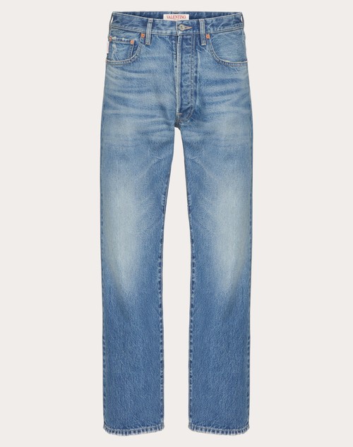 Valentino PANTALÓN DE DENIM CON DETALLE DE V METÁLICA