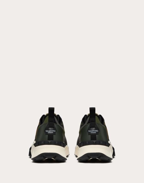 Valentino ZAPATILLA TRUE ACT DE CAÑA BAJA HECHAS DE TEJIDO ENGOMADO CON MOTIVO CAMOUFLAGE