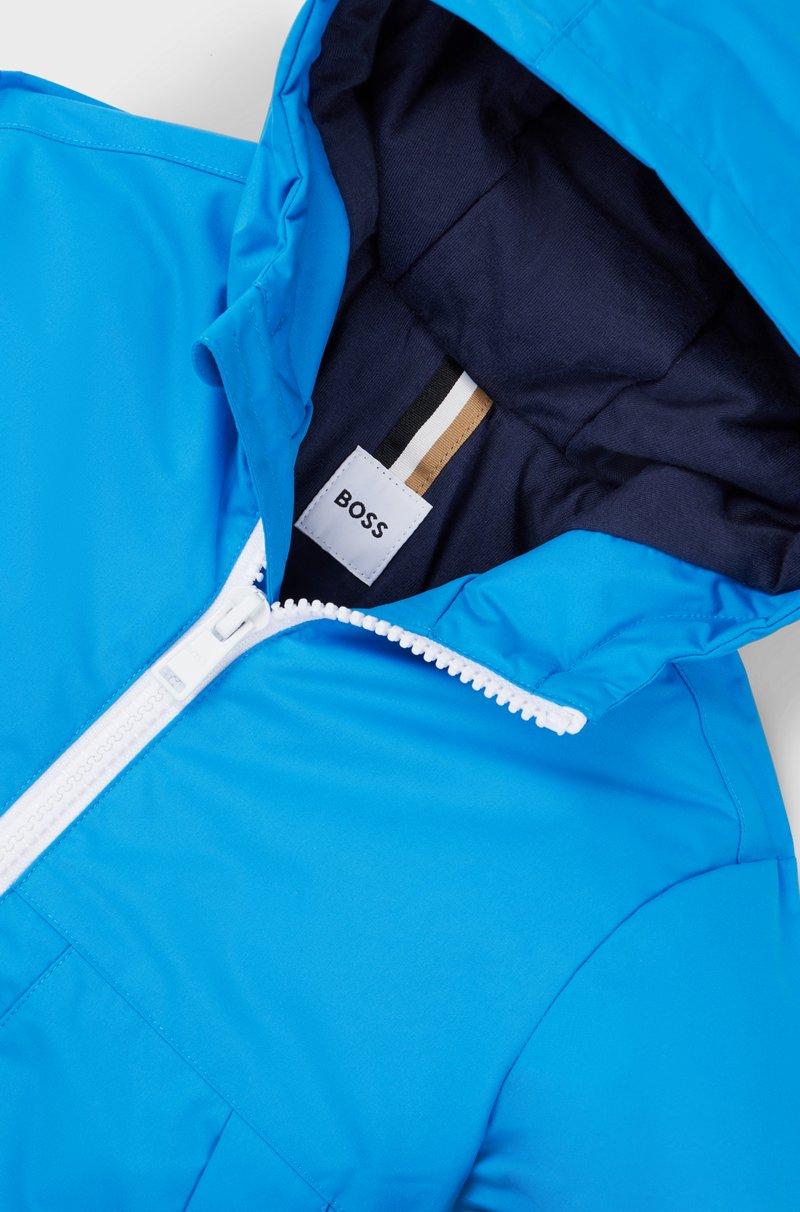 Hugo Boss Cazadora Cortavientos Con Capucha Para Niños Con Estampado De Monogramas Que Aparece Con Agua