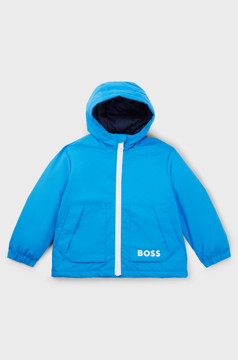 Hugo Boss Cazadora cortavientos con capucha para niños con estampado de monogramas que aparece con agua