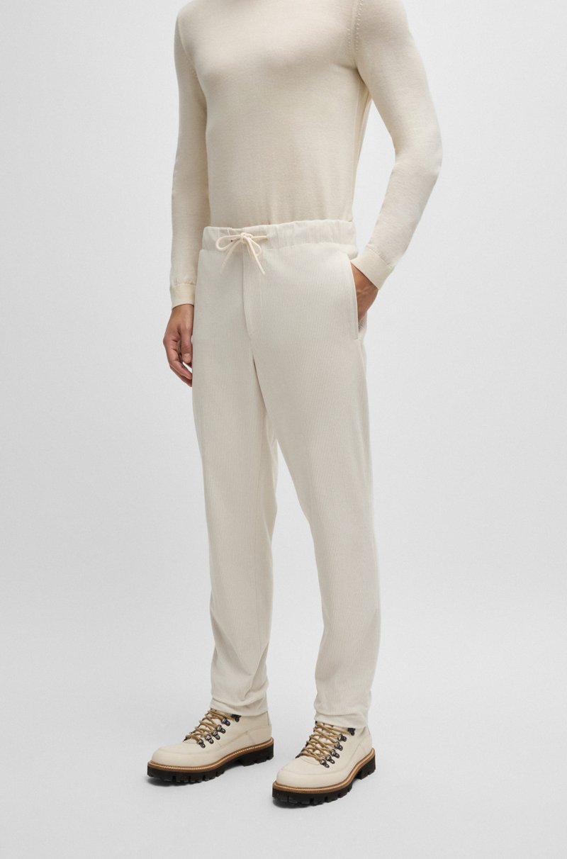 Hugo Boss Pantalones tapered fit de pana técnica