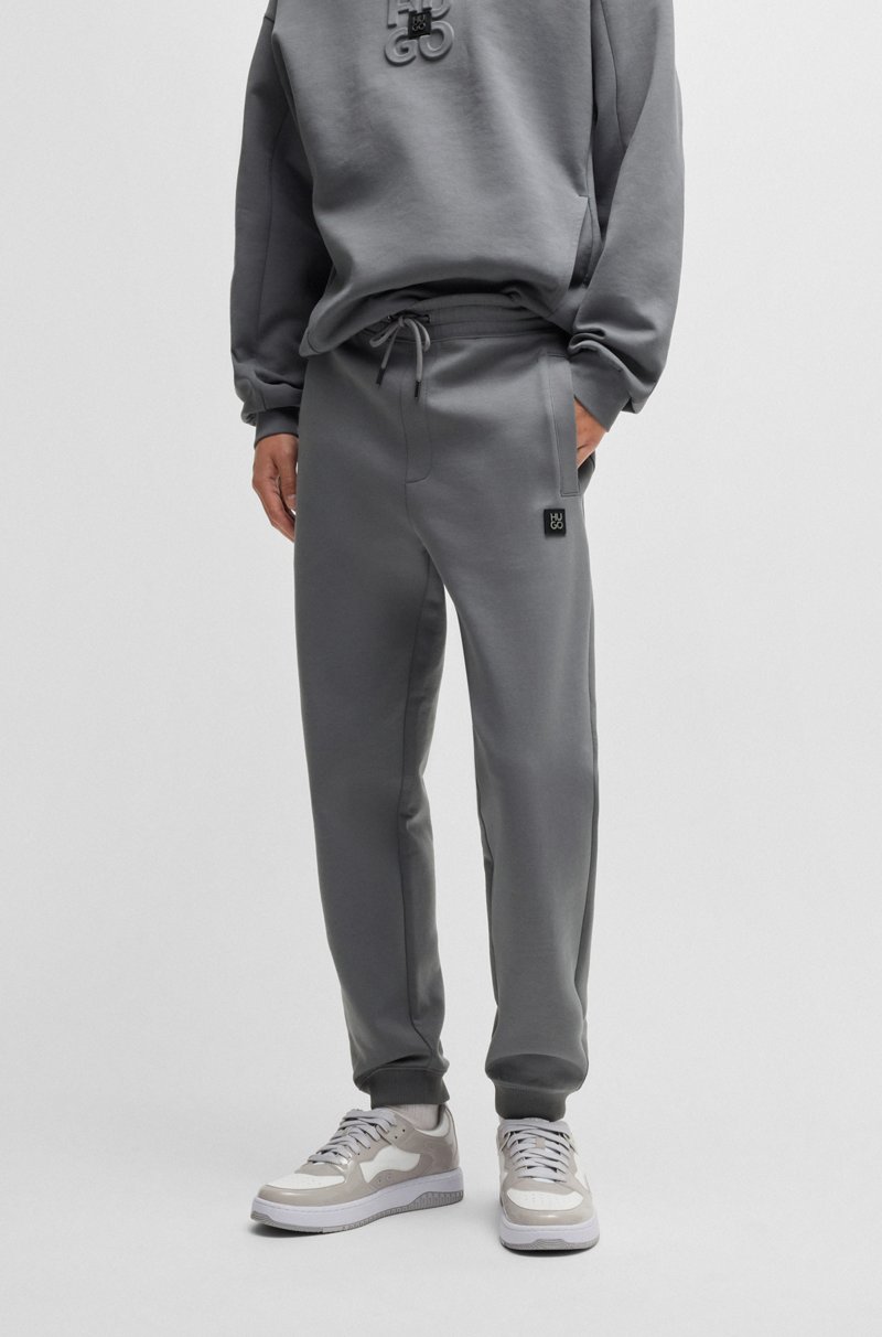 Hugo Boss Pantalones de chándal de algodón con logo apilado