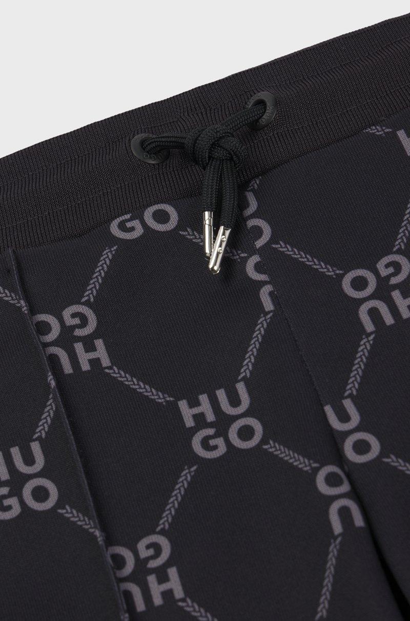 Hugo Boss Pantalones De Chándal Loose Fit Para Niños Con Logo Apilado Estampado