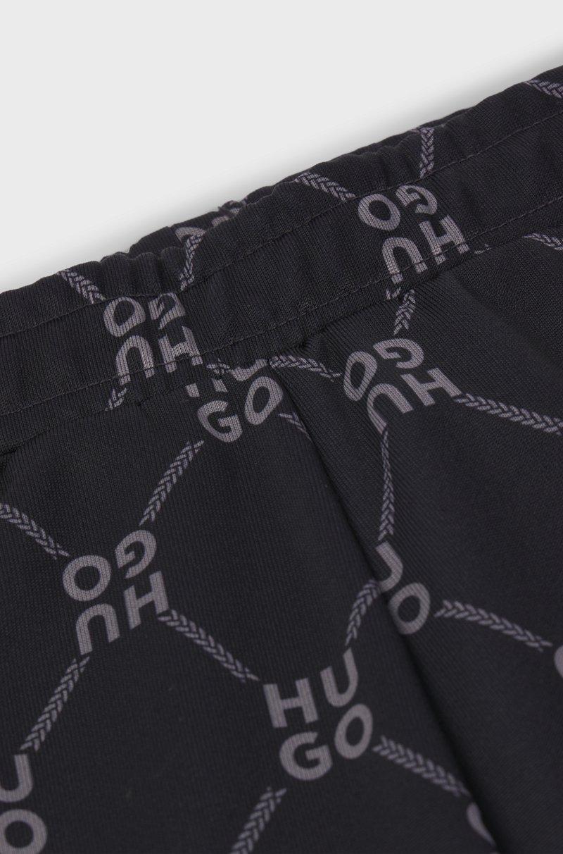 Hugo Boss Pantalones De Chándal Loose Fit Para Niños Con Logo Apilado Estampado