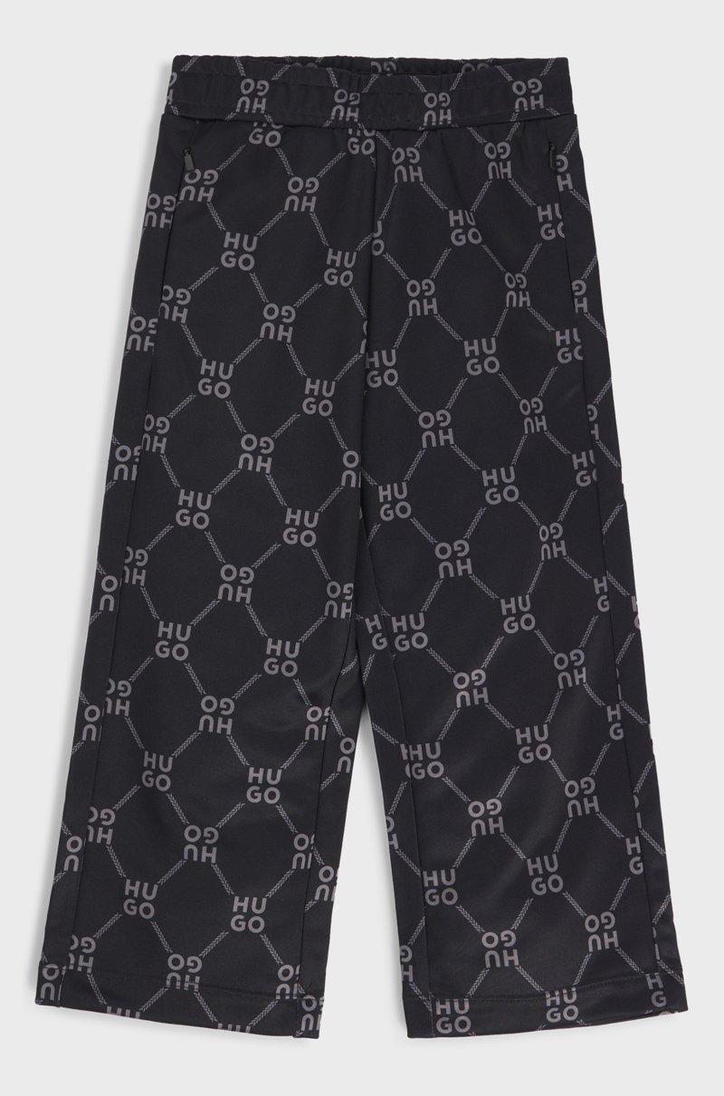 Hugo Boss Pantalones de chándal loose fit para niños con logo apilado estampado