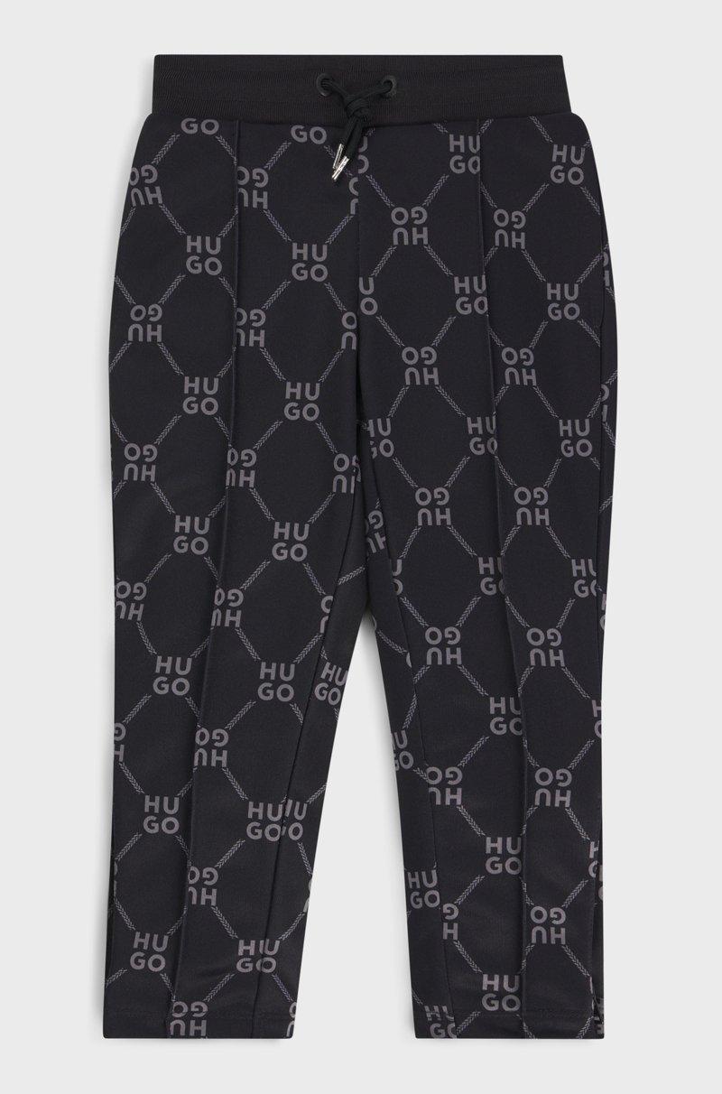 Hugo Boss Pantalones de chándal loose fit para niños con logo apilado estampado