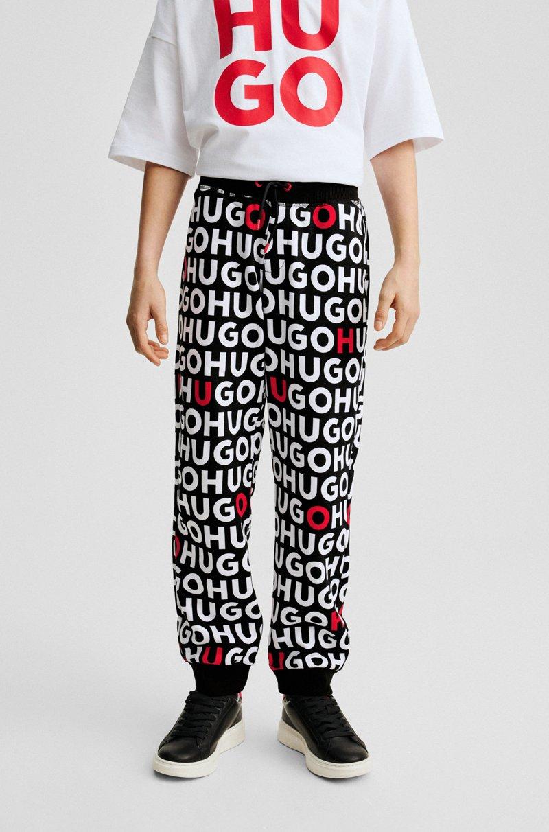 Hugo Boss Pantalones de chándal para niños en algodón con logos estampados