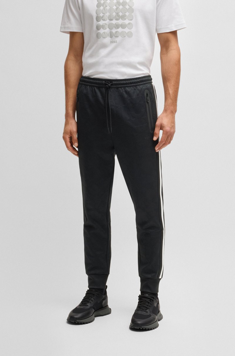 Hugo Boss Pantalones de chándal relaxed fit con círculos tejidos en jacquard