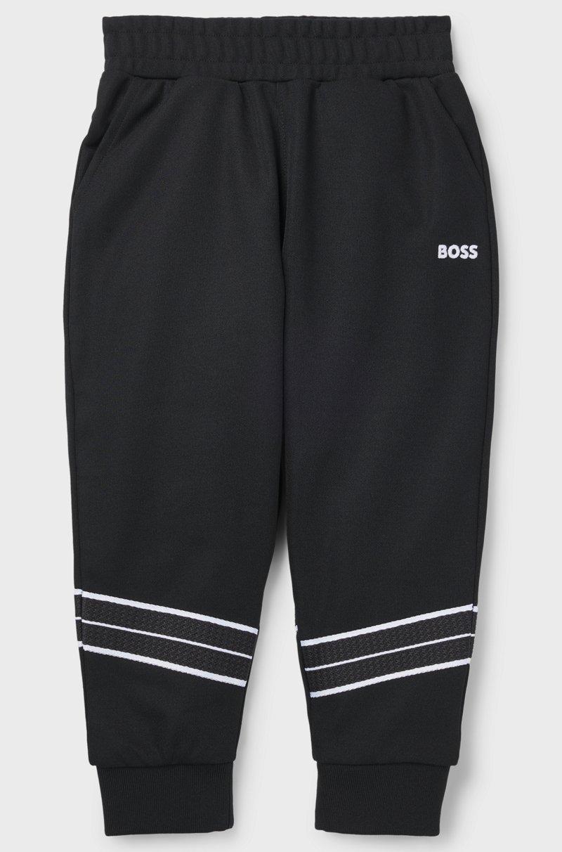 Hugo Boss Pantalones de chándal tapered fit para niños con ribetes de espiga