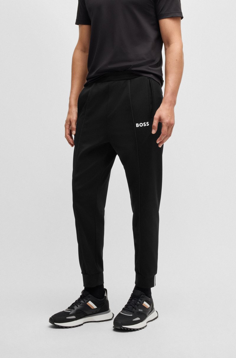 Hugo Boss Pantalones regular fit en tejido de gabardina elástico con detalle de logo