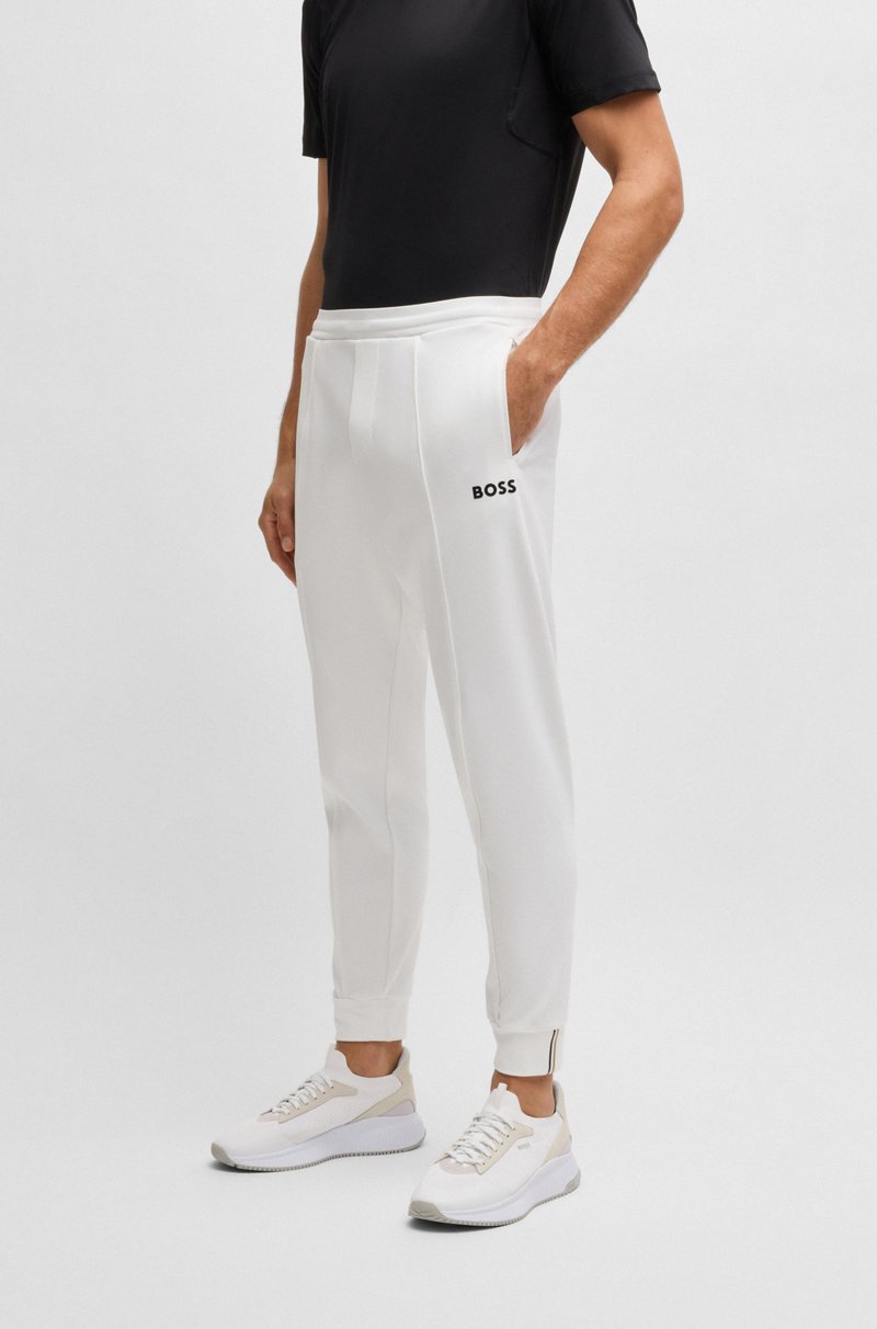 Hugo Boss Pantalones regular fit en tejido de gabardina elástico con detalle de logo