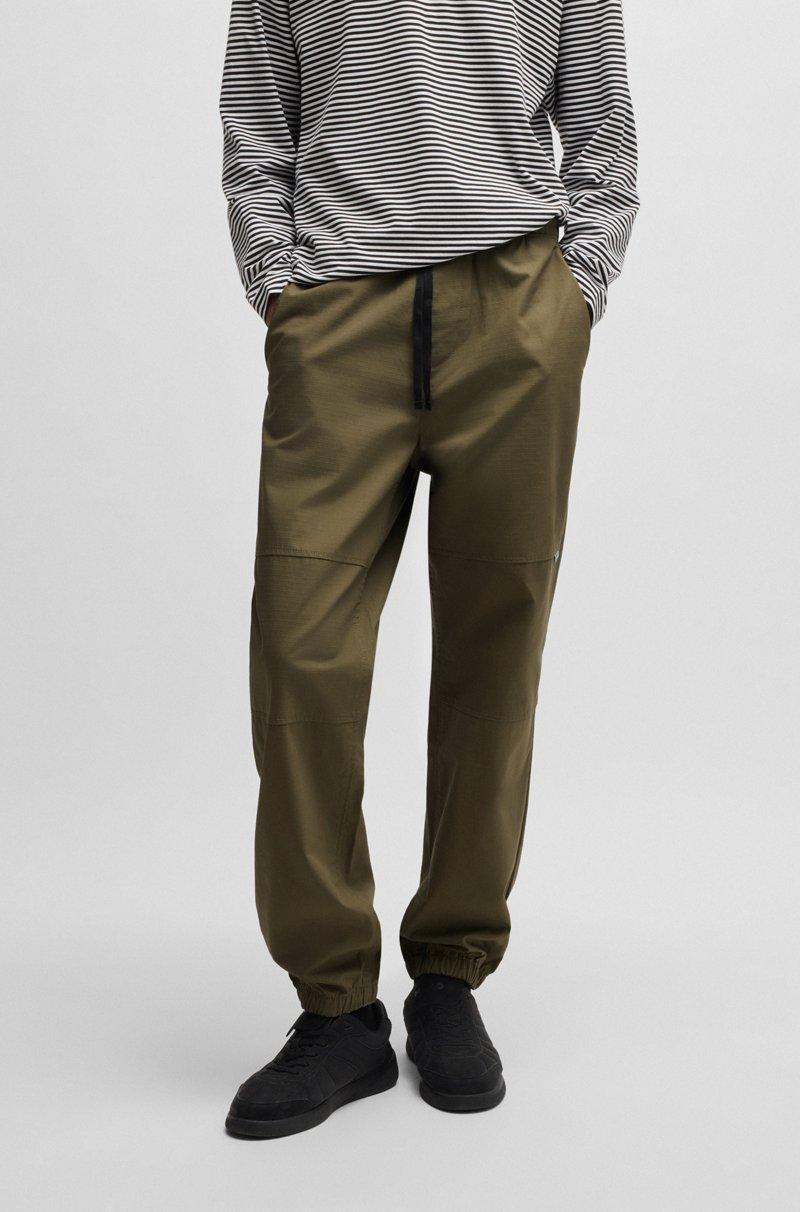 Hugo Boss Pantalones tapered-fit de algodón estructurado