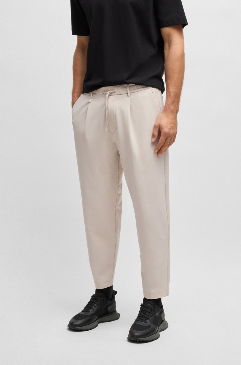 Hugo Boss Pantalones tapered fit de tejido elástico repelente al agua
