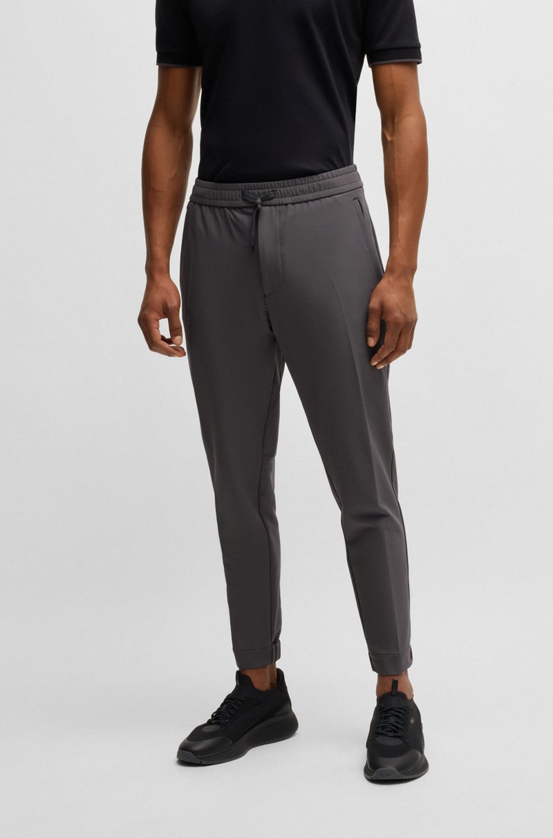 Hugo Boss Pantalones tapered fit de tejido elástico repelente al agua