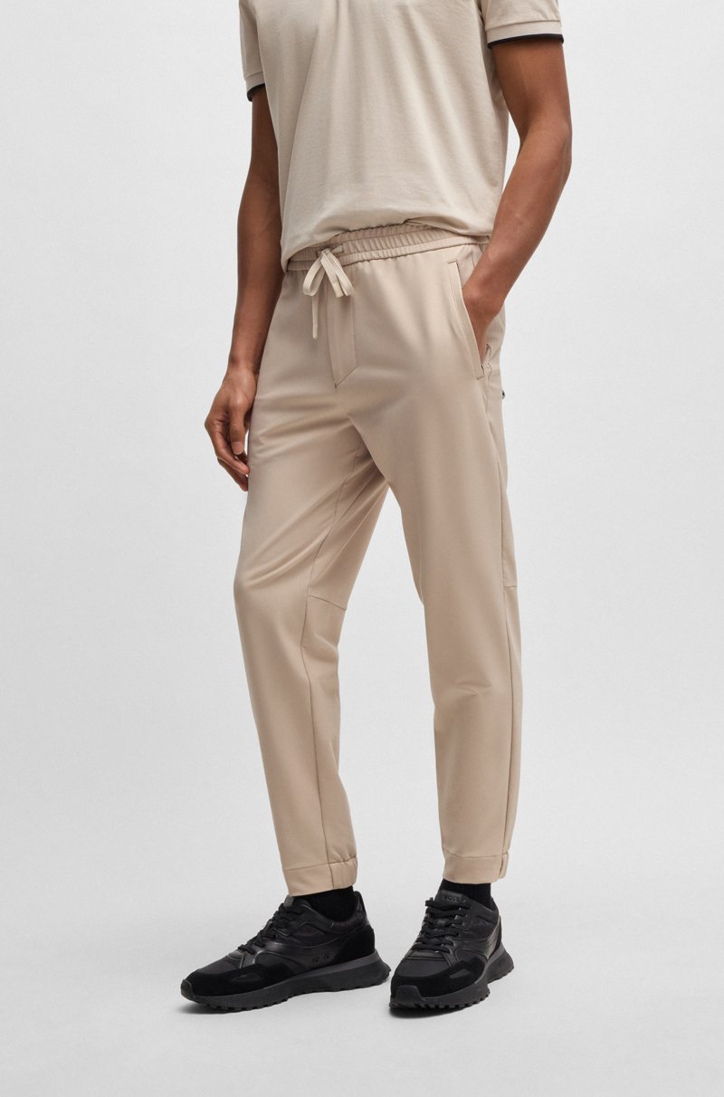 Hugo Boss Pantalones tapered fit de tejido elástico repelente al agua