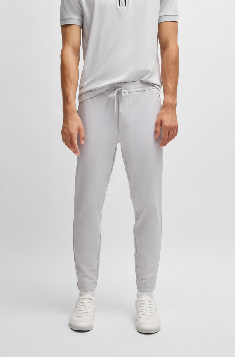 Hugo Boss Pantalones tapered fit de tejido elástico repelente al agua