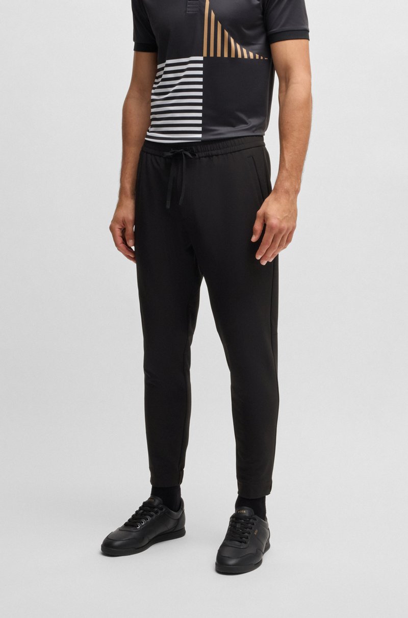 Hugo Boss Pantalones tapered fit de tejido elástico repelente al agua