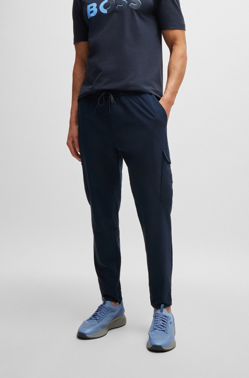 Hugo Boss Pantalones tapered fit en popelín elástico de planchado fácil