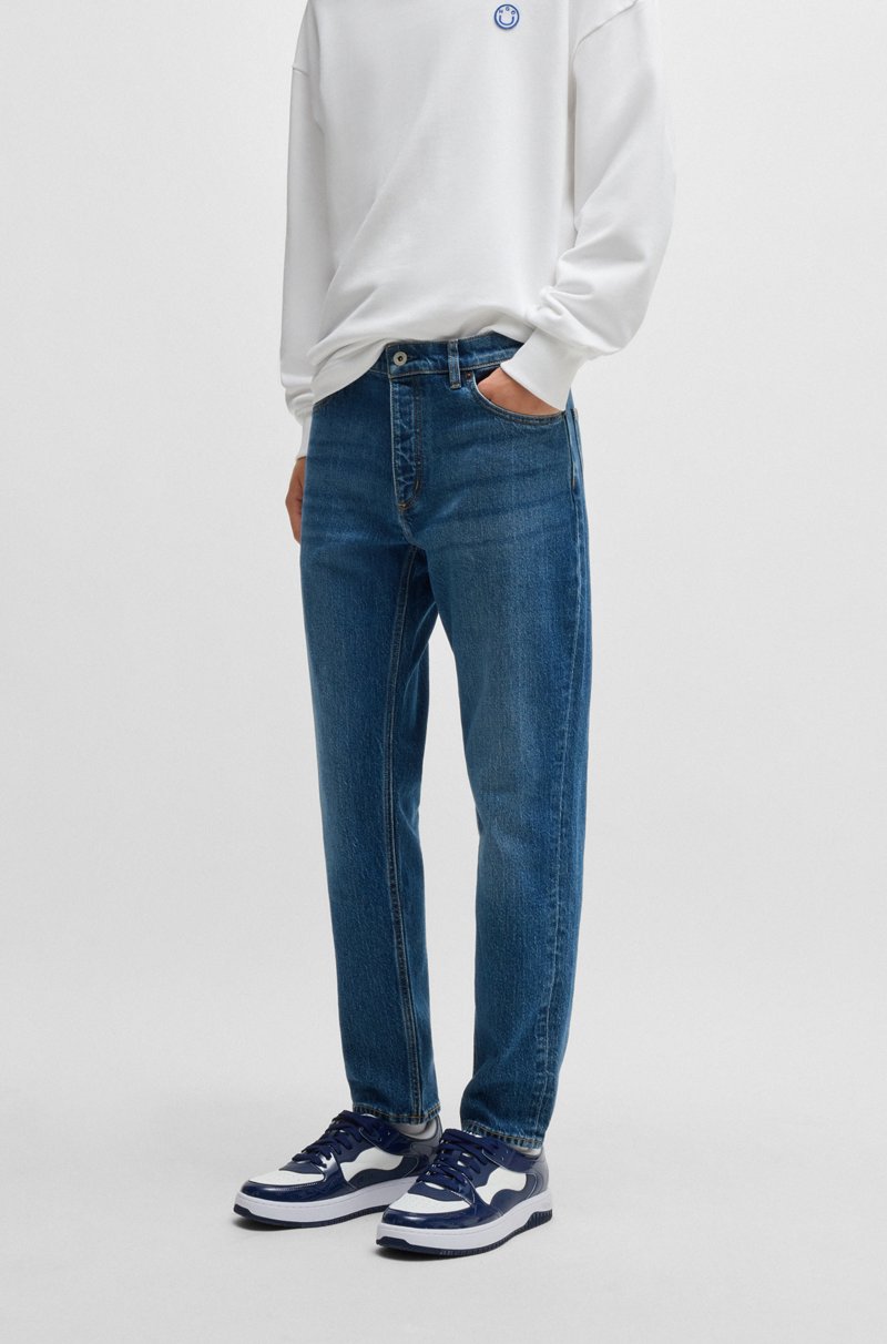 Hugo Boss Vaqueros tapered fit en denim elástico azul medio