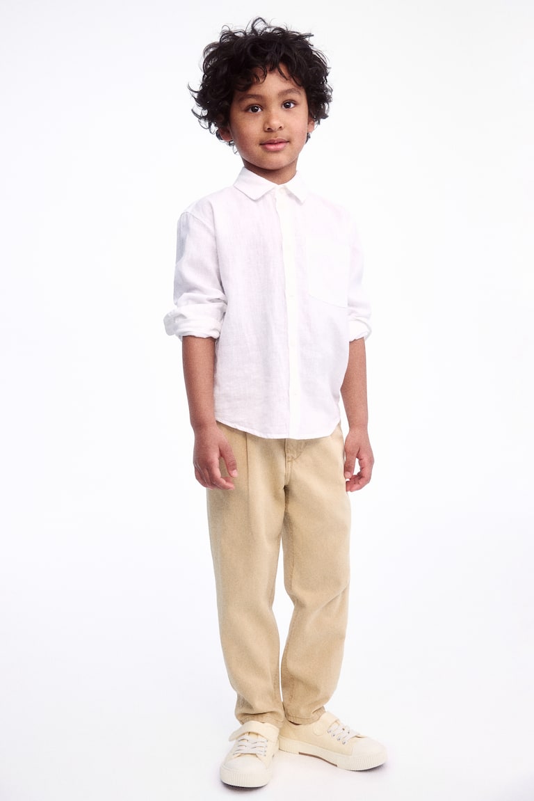 H&M Chinos pitillo de corte holgado en sarga - Beige - NIÑOS