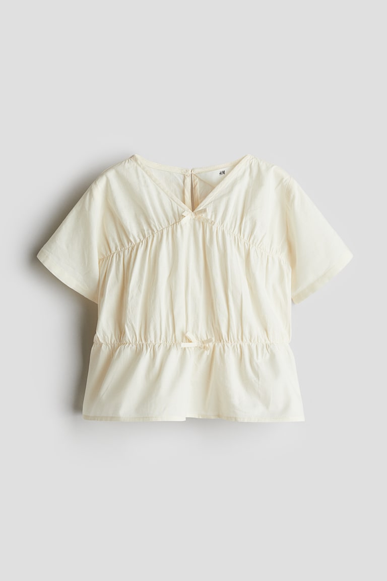 H&M Blusa de algodón con peplo - Crema - NIÑOS
