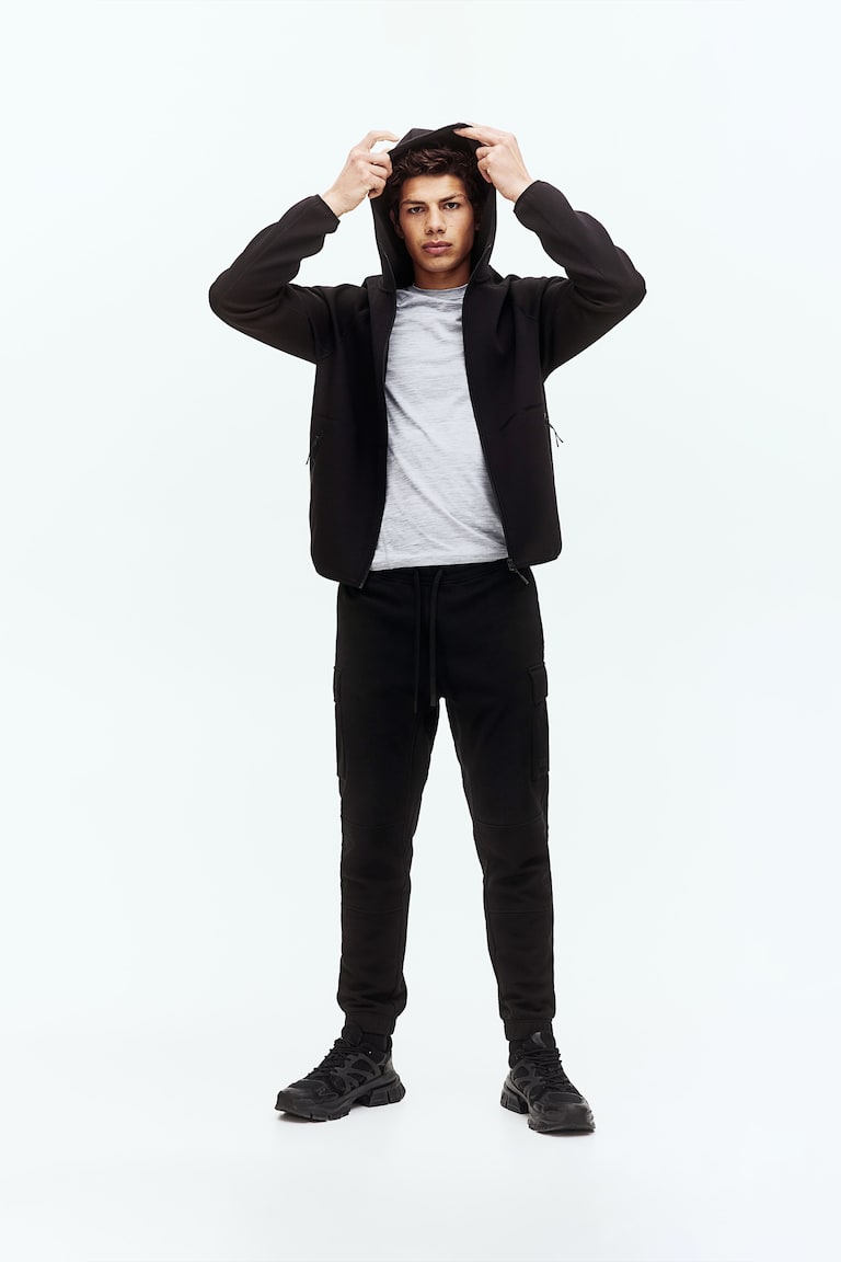 H&M Joggers cargo de algodón con DryMove™ Regular Fit - Negro - HOMBRE