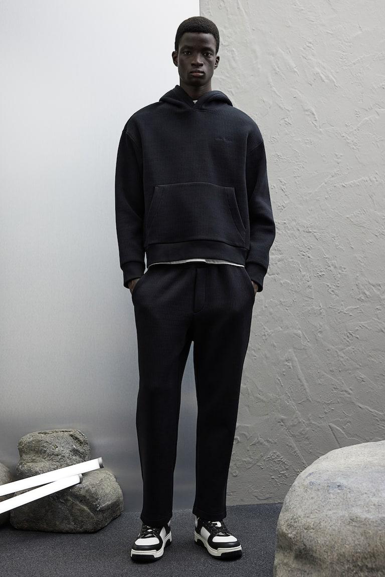 H&M Sudadera de canalé con capucha Loose Fit - Negro - HOMBRE