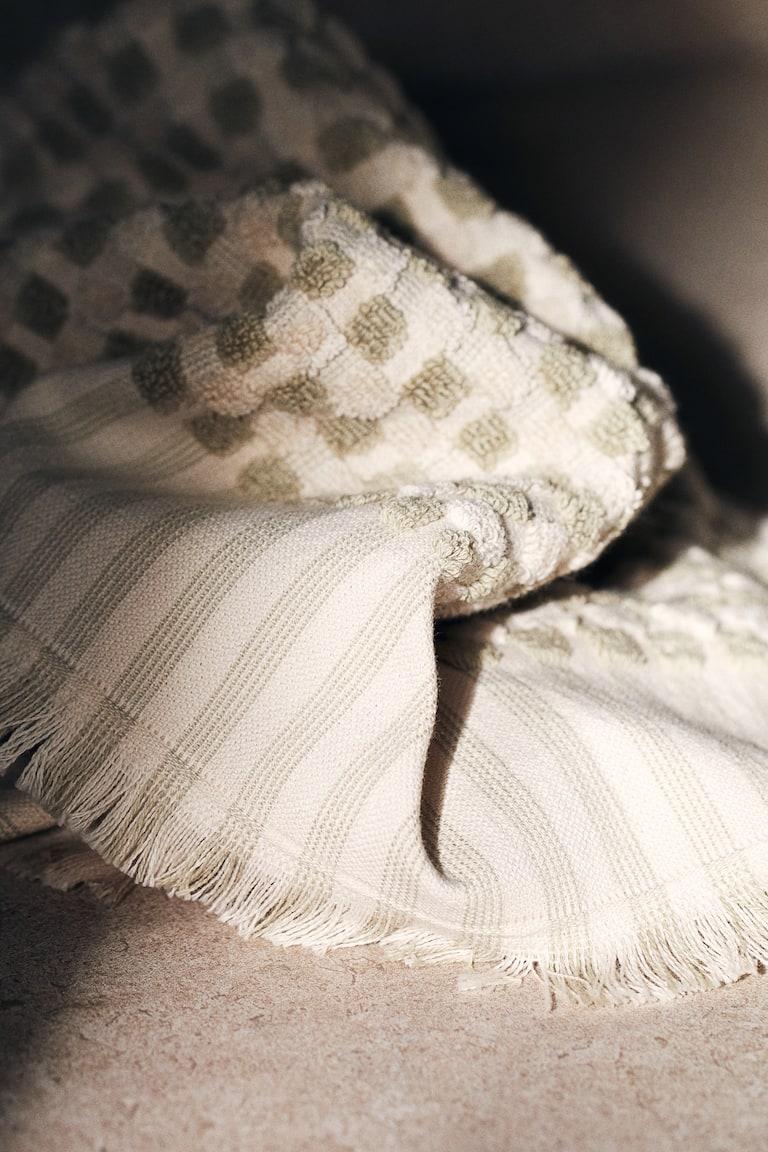 H&M Toalla de mano estampada en algodón rizado - Verde/Lunares - HOME